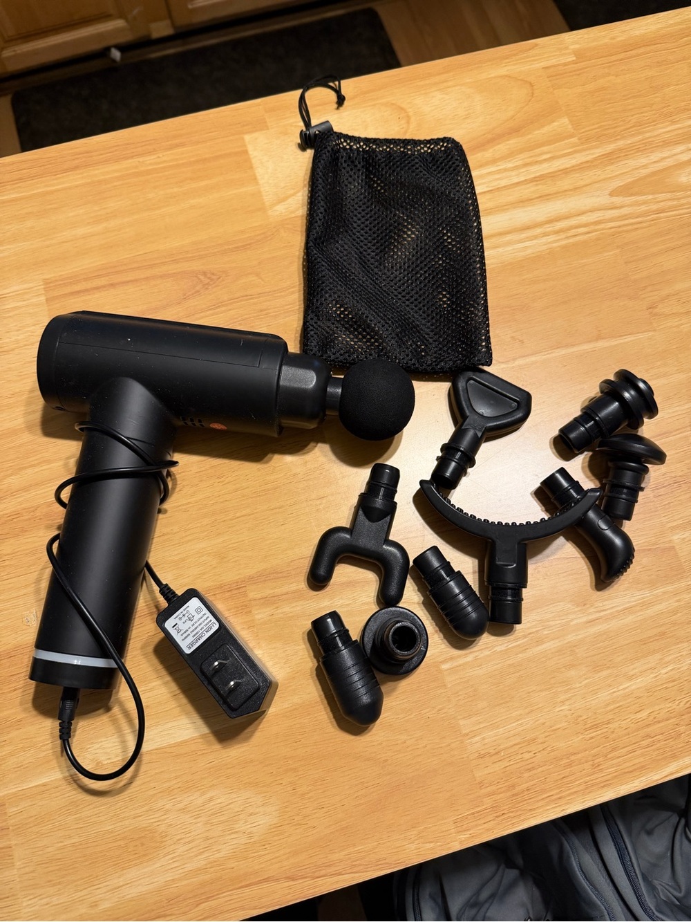 Black Percussion Massage Gun with Multiple Attachments